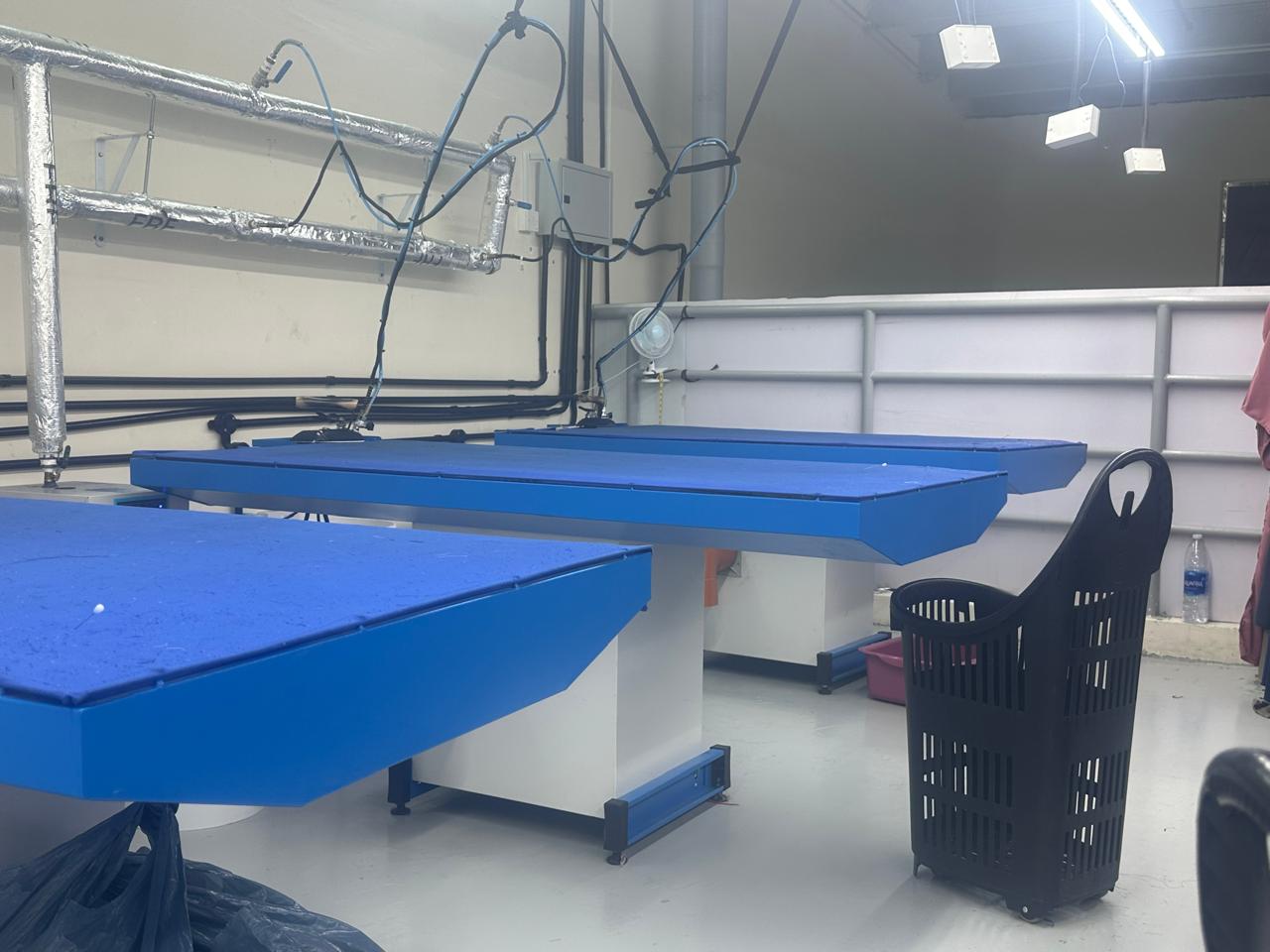 Industrial steam iron tables for professional abaya finishing